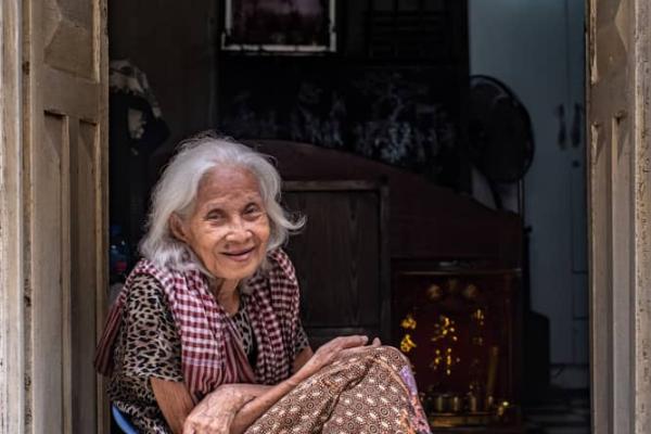 Old woman at her door